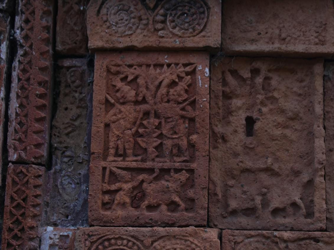 Göbeklitepe carvings Close-up of animal carvings on ancient stone pillars from Göbeklitepe showing detailed engravings of lions, snakes, and birds
