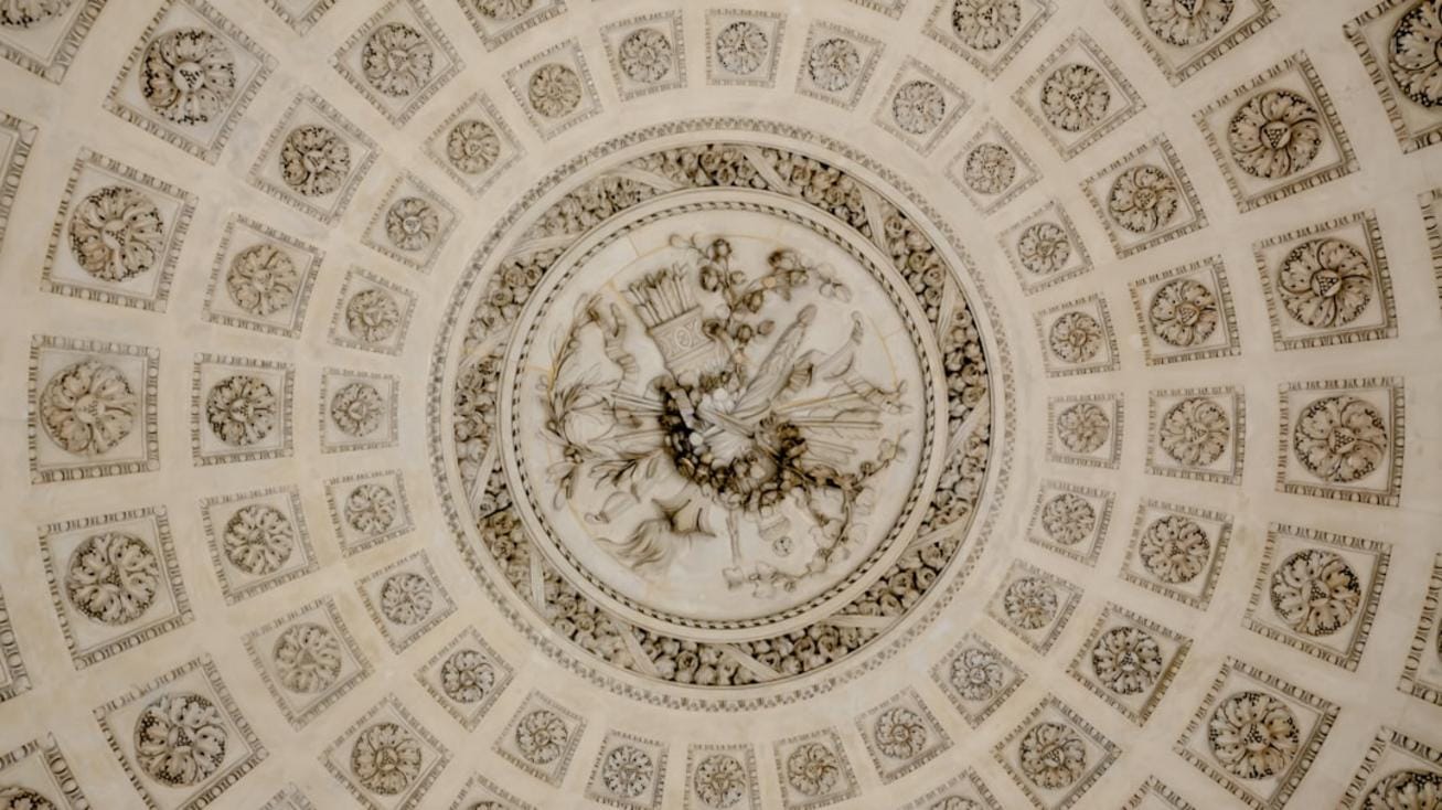 Göbeklitepe structures A panoramic view of Göbeklitepe revealing its massive carved stone pillars arranged in circular formations under a clear sky.