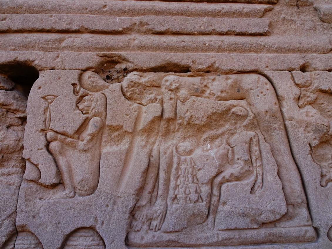 Close-up of carved stone reliefs on Göbeklitepe pillars illustrating animal and abstract motifs, emphasizing early symbolic thought.