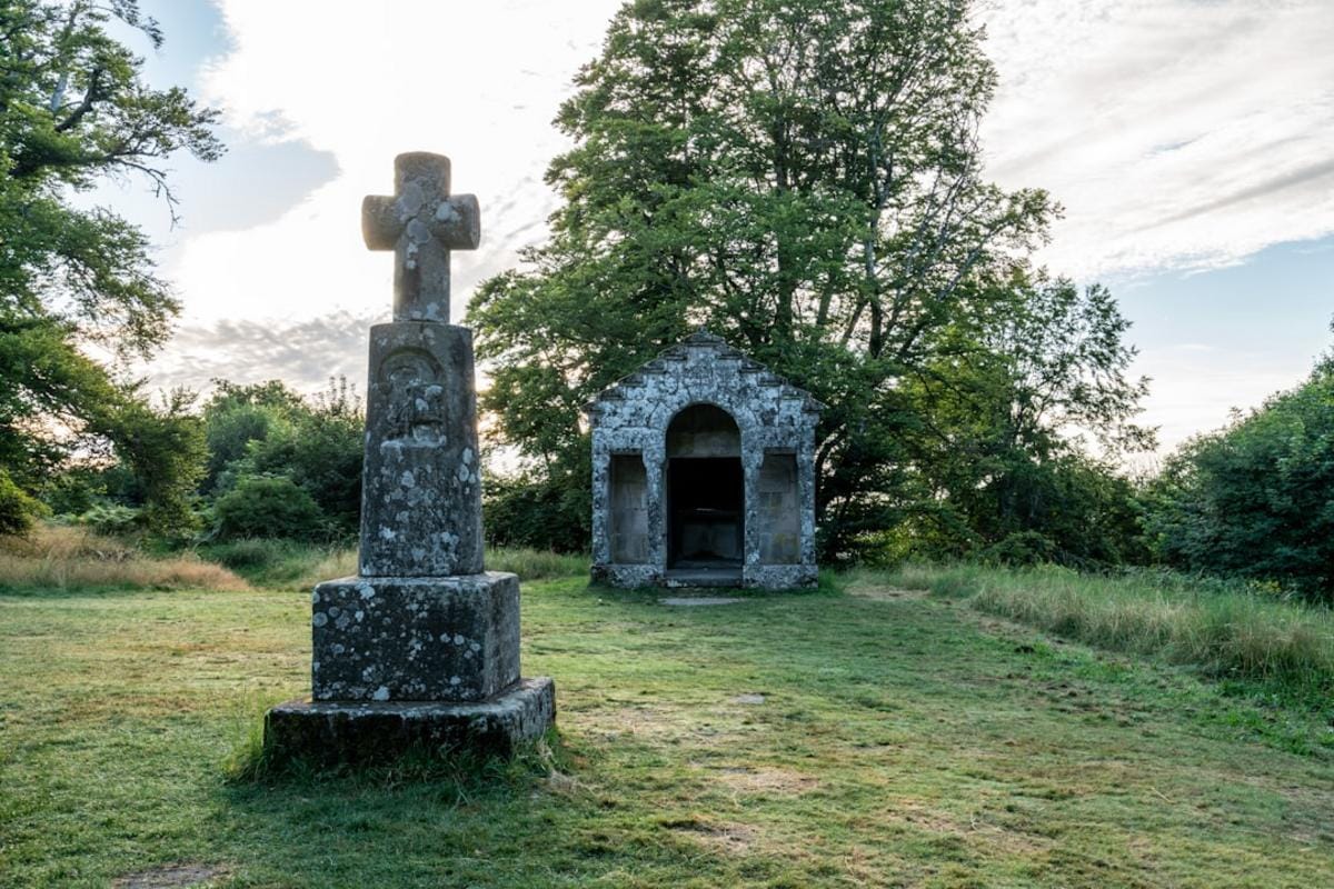 an artist's impression of Göbekli Tepe with its towering stones and circular formations at sunrise