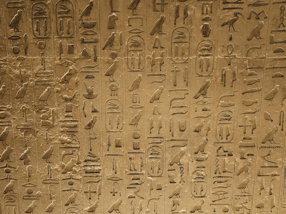 Close-up of detailed carvings on Göbeklitepe’s stone pillars depicting animals and abstract symbols